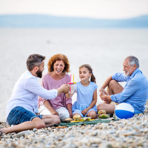A multigeneration family on a holiday near the water